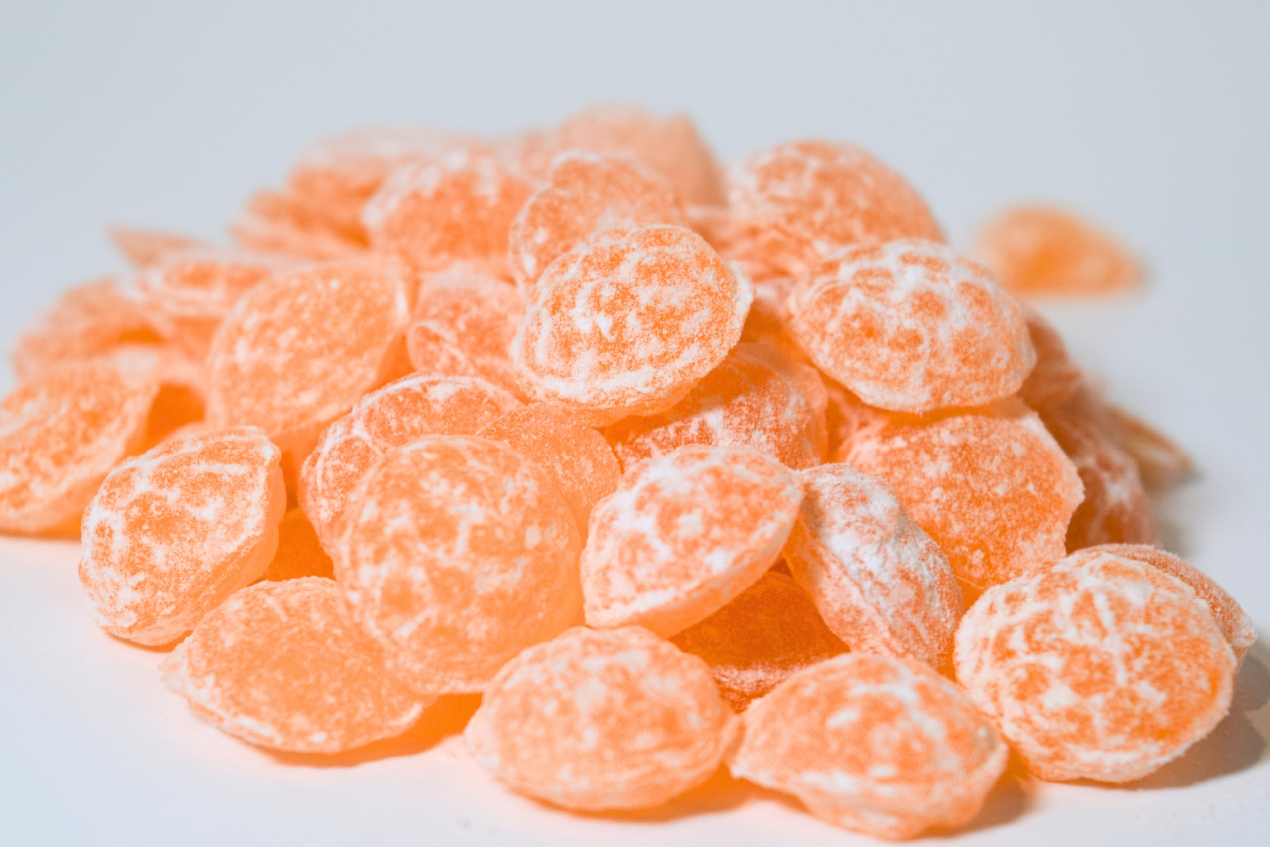 Sour Drops Blue Raspberry candies close-up with intense sour and sweet core.