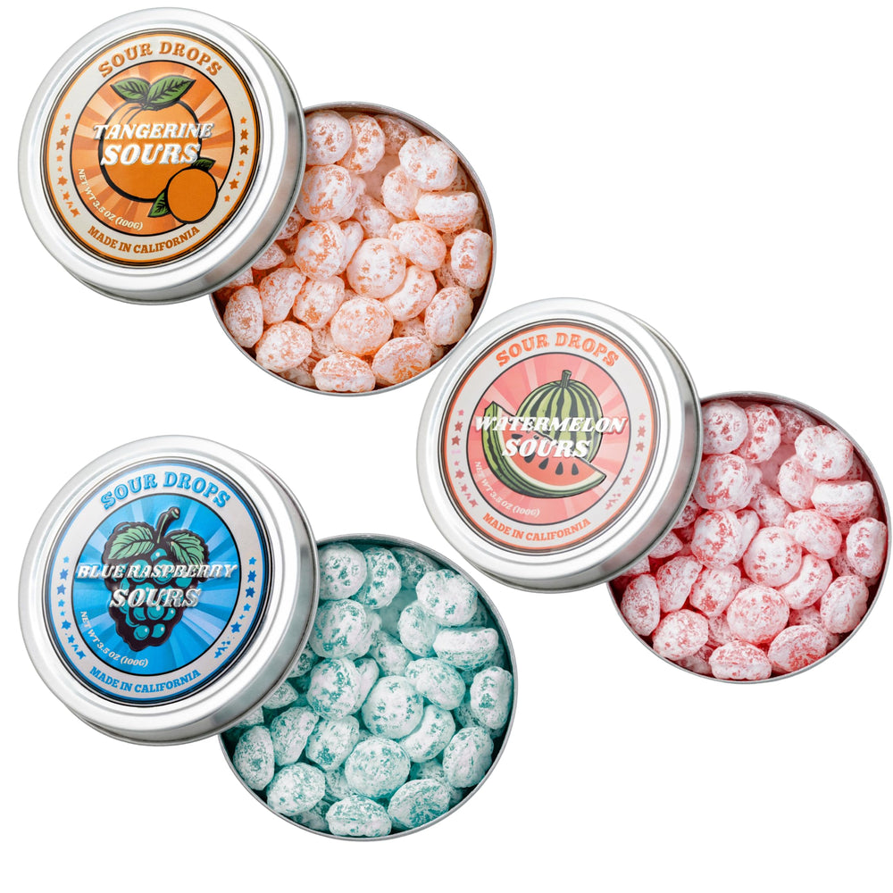 Sour Drops Tangerine tin close-up showing bold sour coating and citrus tang.