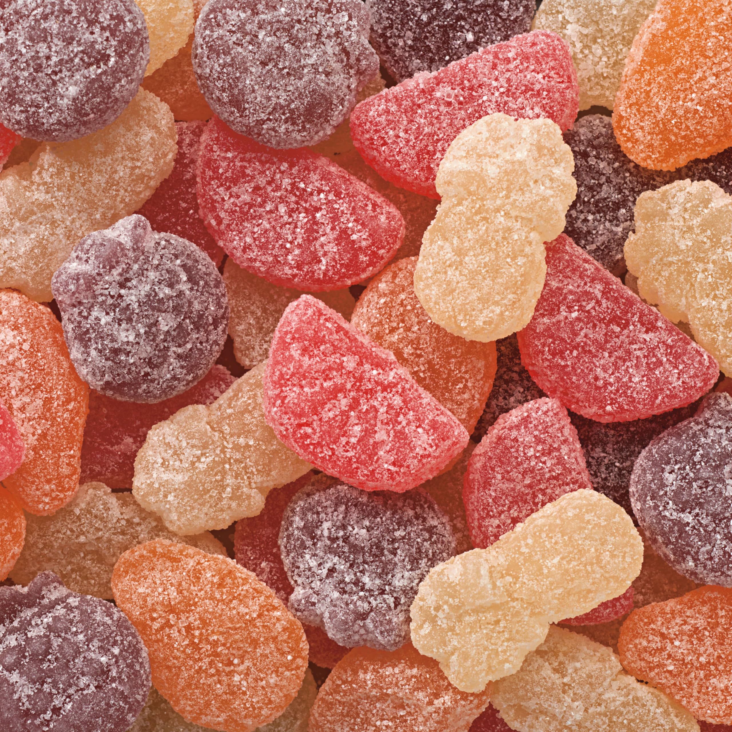 Sour Patch Kids Fruits Tropical Mix passion fruit piece among vivid colors.