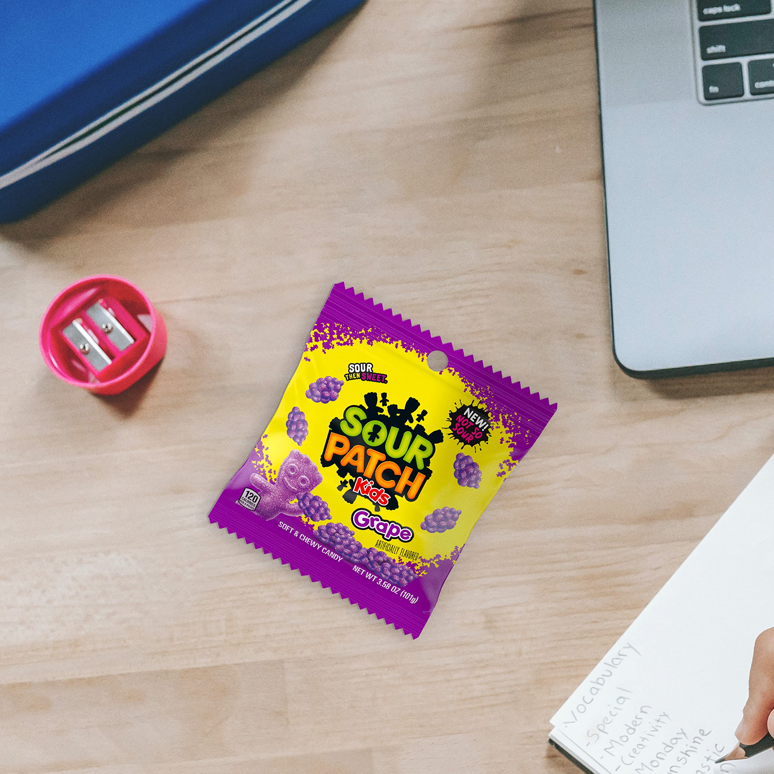 Colorful grape Sour Patch Kids candy shapes close-up.
