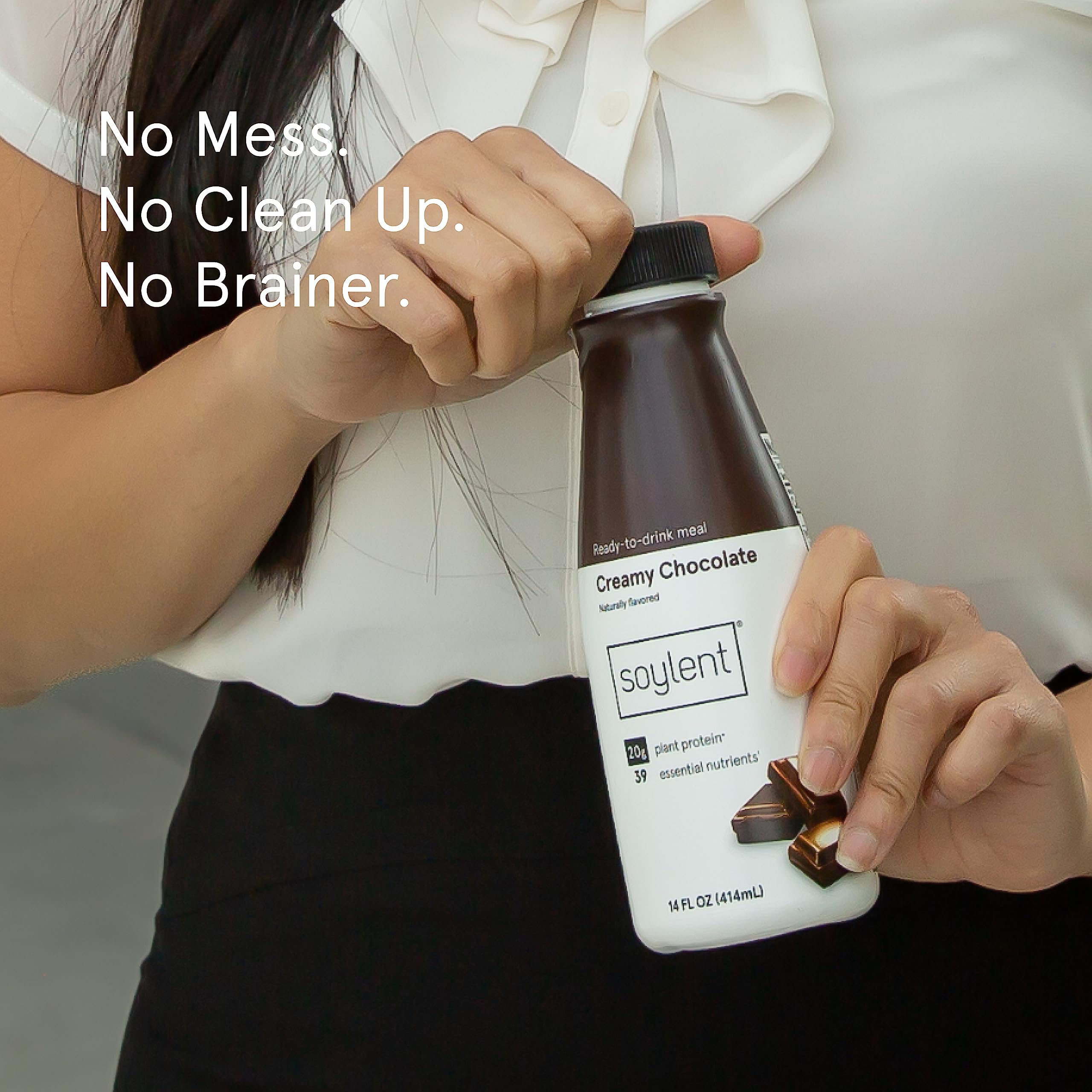 Soylent Creamy Chocolate glass being poured to reveal creamy texture