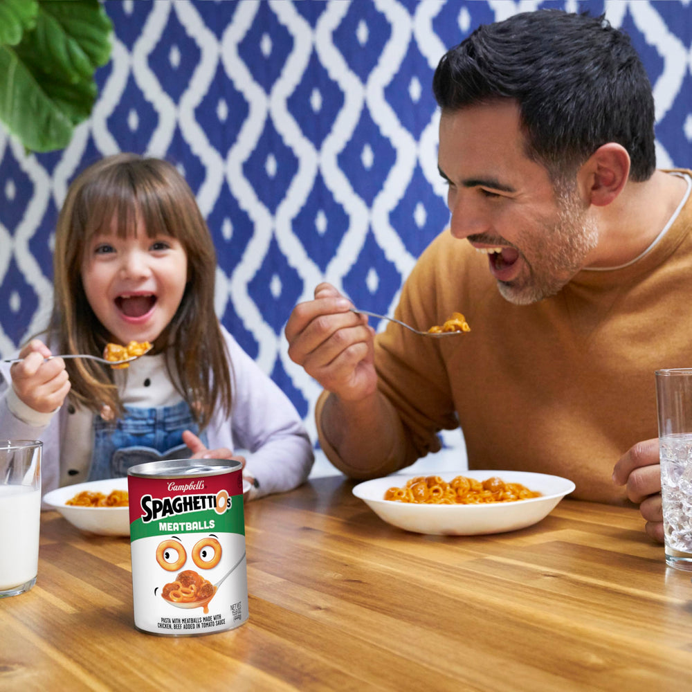 SpaghettiOs saucy tomato sauce close-up, showcasing comforting flavor in minutes.