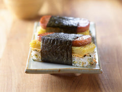 SPAM Classic sliced on plate, savory texture for breakfast or lunch.