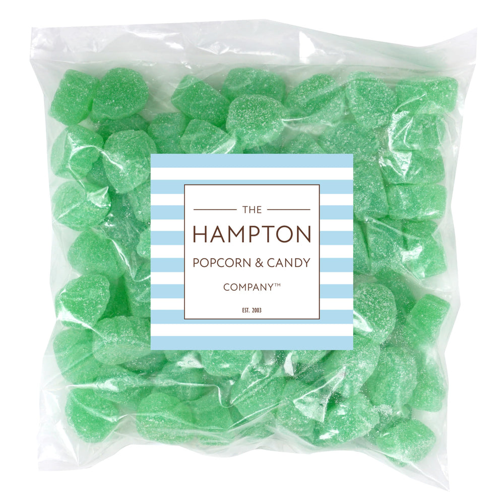 Spearmint leaves candy close-up dusted with sugar, highlighting minty aroma.