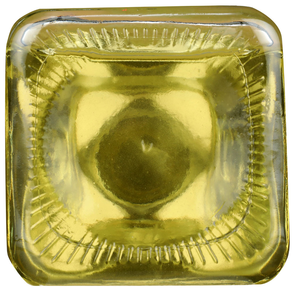 Spectrum Organic Safflower Oil bottle on stove, ready for cooking and frying tasks.