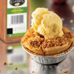 Measuring spoon with Spice Classics ground cinnamon for precise seasoning.