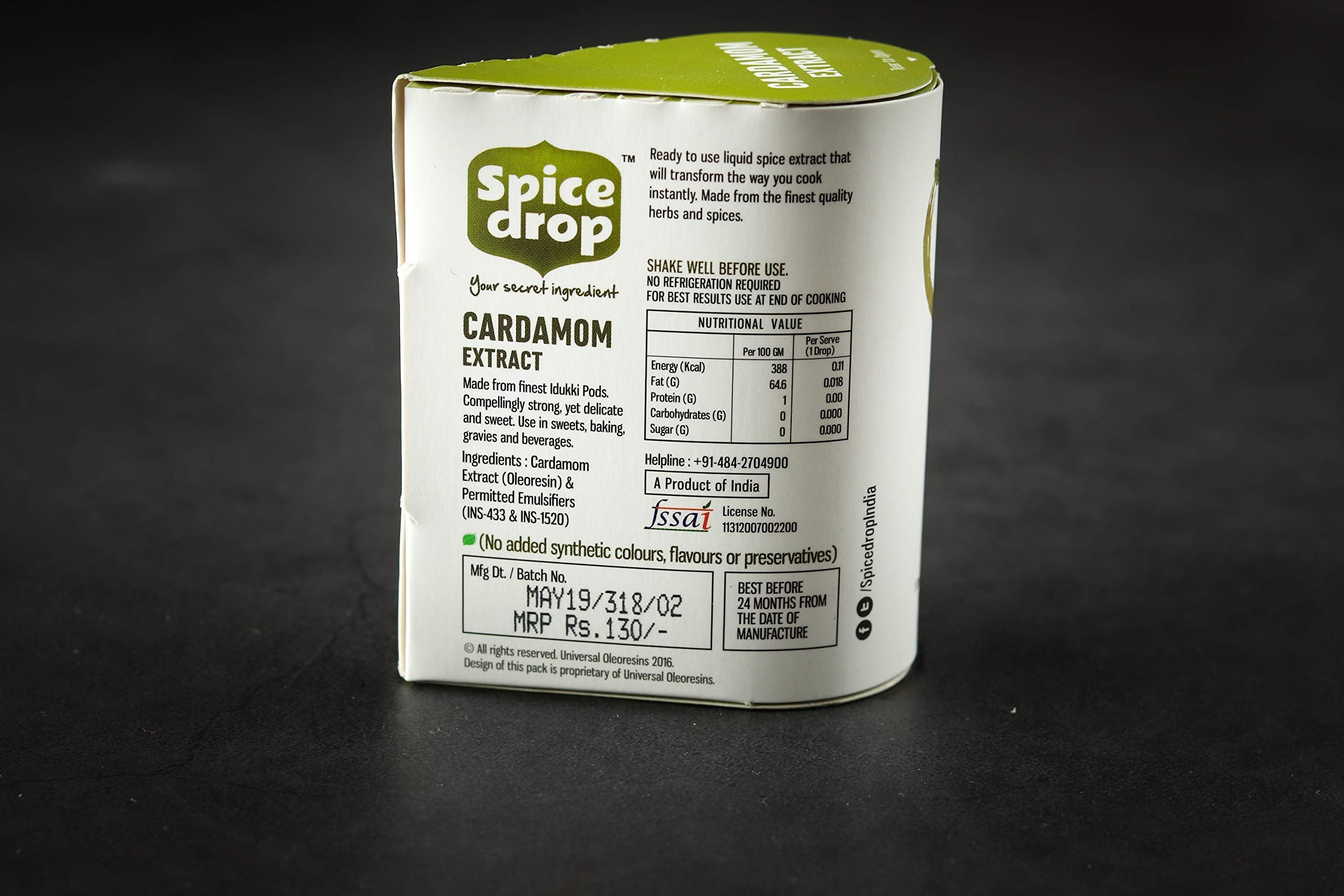 Spice Drop Cardamom Extract poured into coffee for bold flavor.