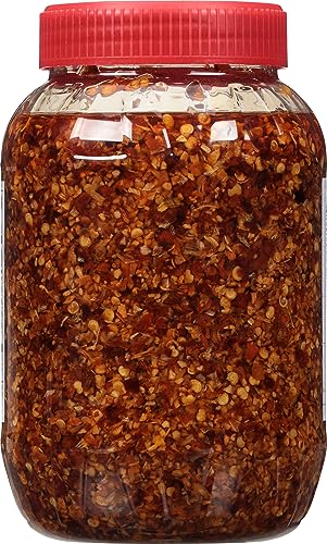 Pan with Spice World Chili Onion Crunch sizzling into a dish.