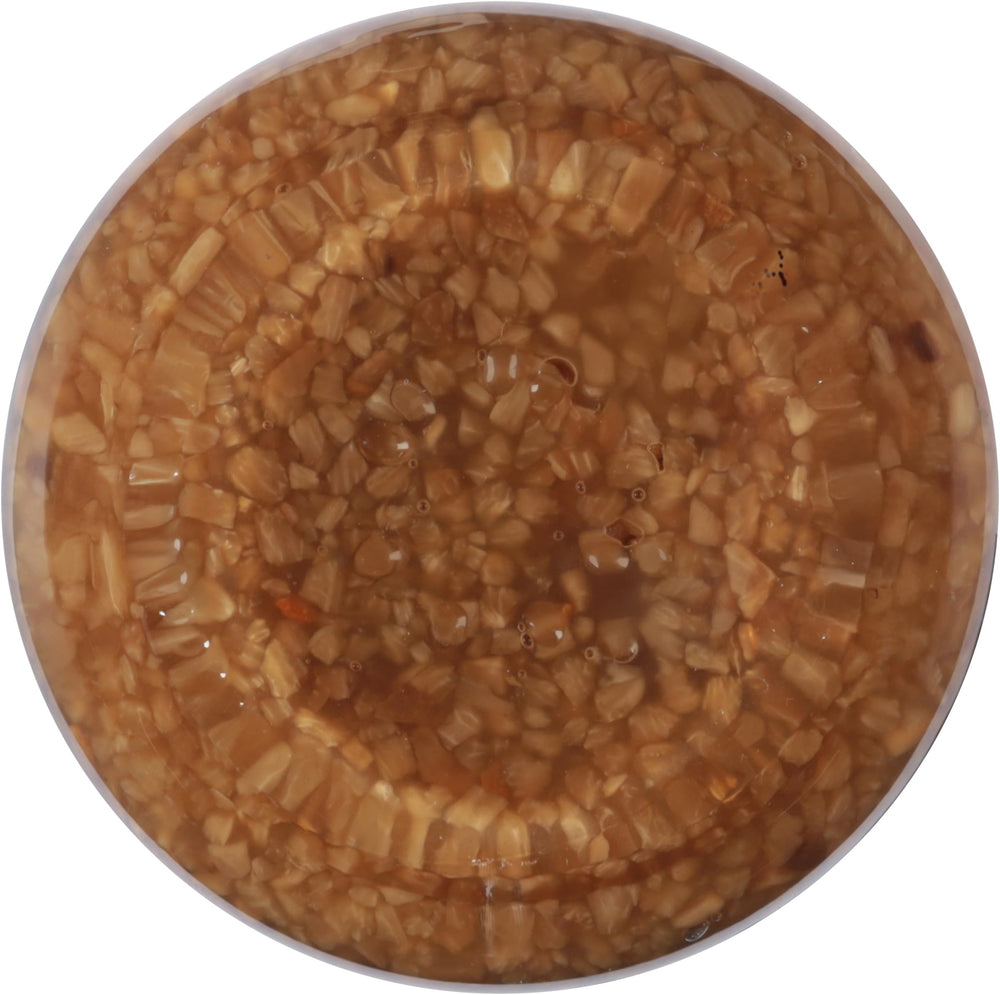 Spice World Roasted Minced Garlic on kitchen counter signals easy flavor at hand