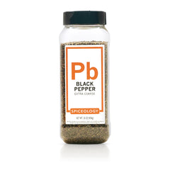 Spiceology Extra Coarse Black Pepper bottle pouring for bold flavor at the table.