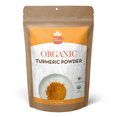 Spicy Organic turmeric powder in a jar, ready for curries and golden milk.