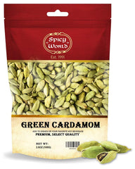 Spicy World cardamom pods beside a tea cup for fragrant chai