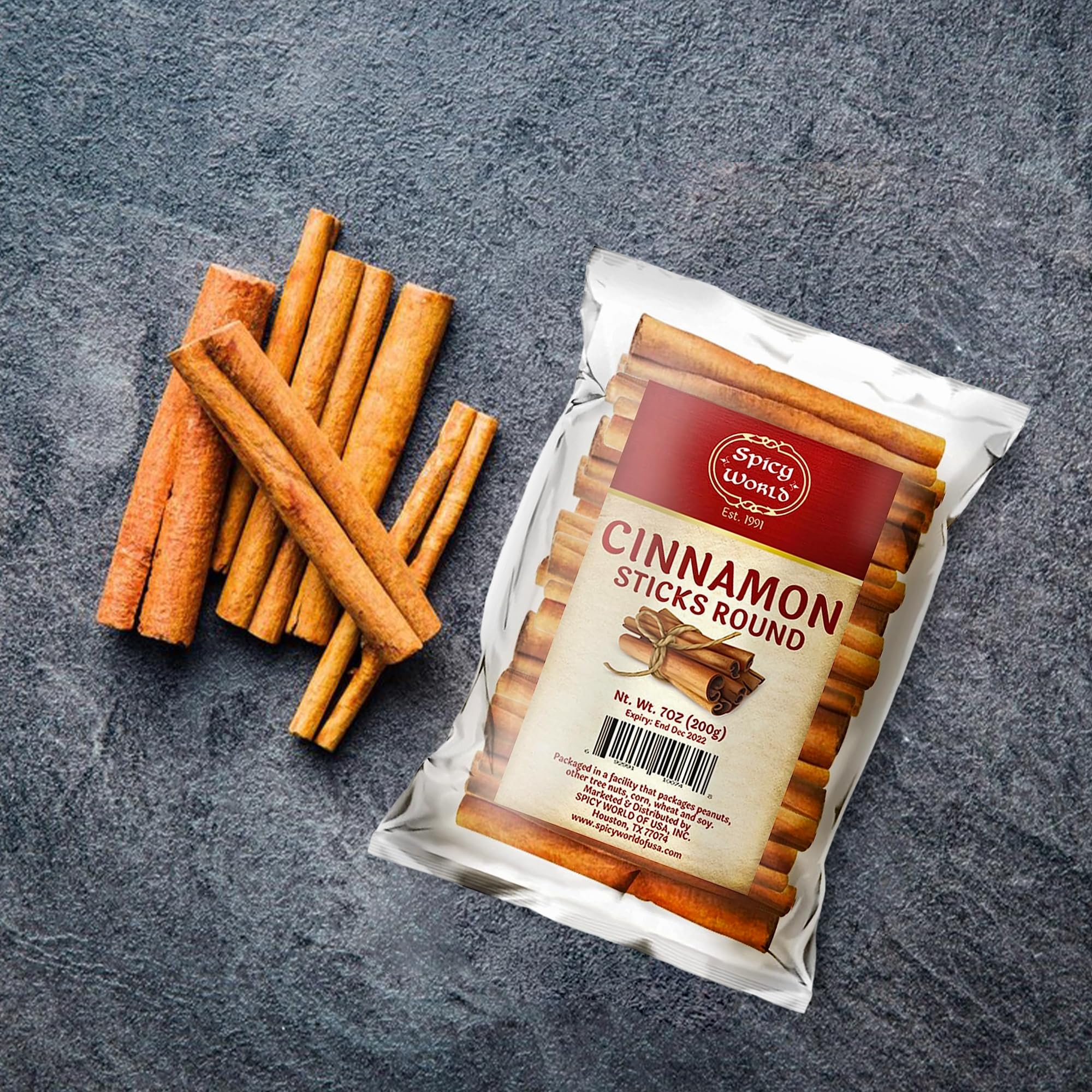 Spicy World cinnamon sticks in spice jar display for easy access.