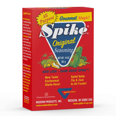 Spike Original All-Purpose Seasoning Salt poured over grilled fish for a brighter flavor.