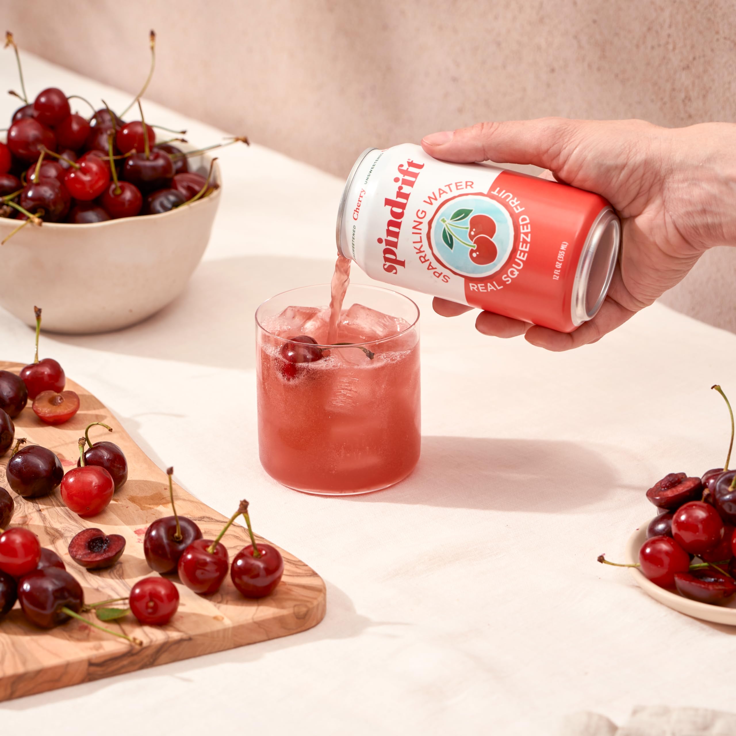 Fresh cherries image conveys real fruit flavor behind Spindrift.