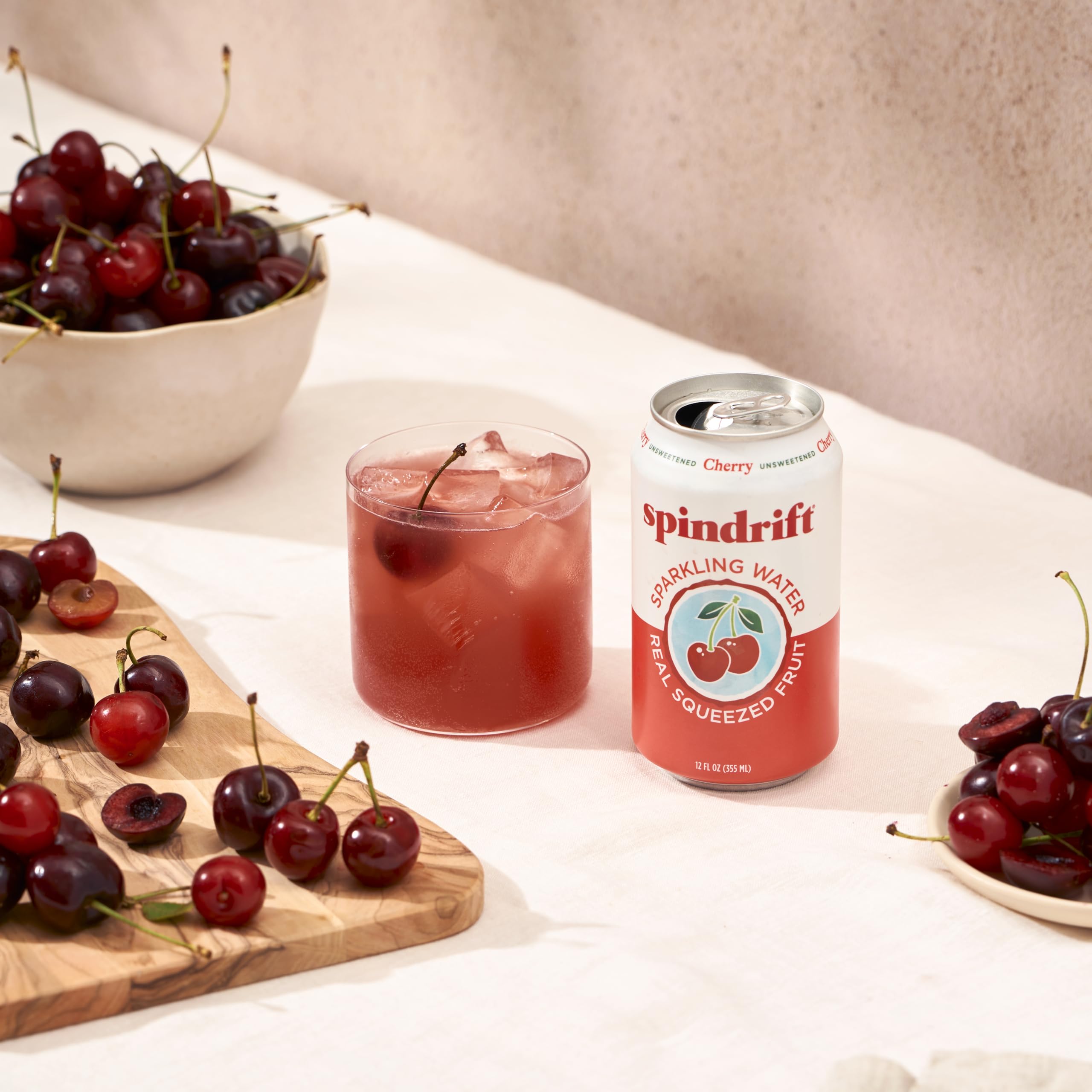 Taste-inspired scene suggests sipping Spindrift Cherry as a refreshing treat.
