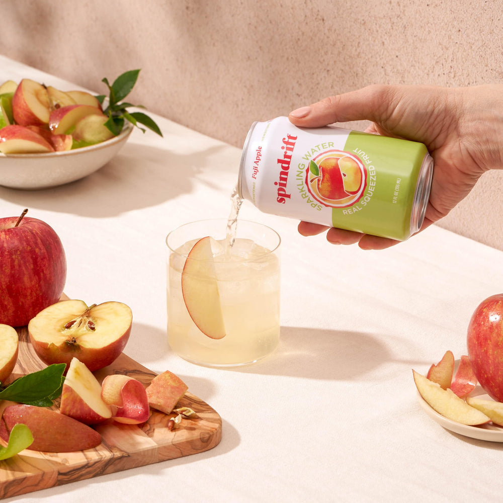 Spindrift Fuji Apple being poured into a glass for a refreshing sip