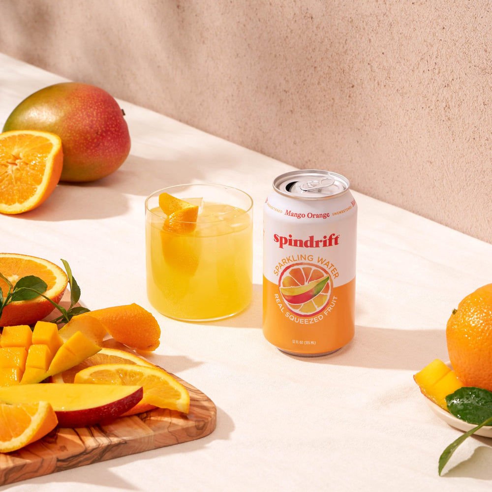 Spindrift Mango Orange sparkling label non-gmo gluten-free highlight product integrity.