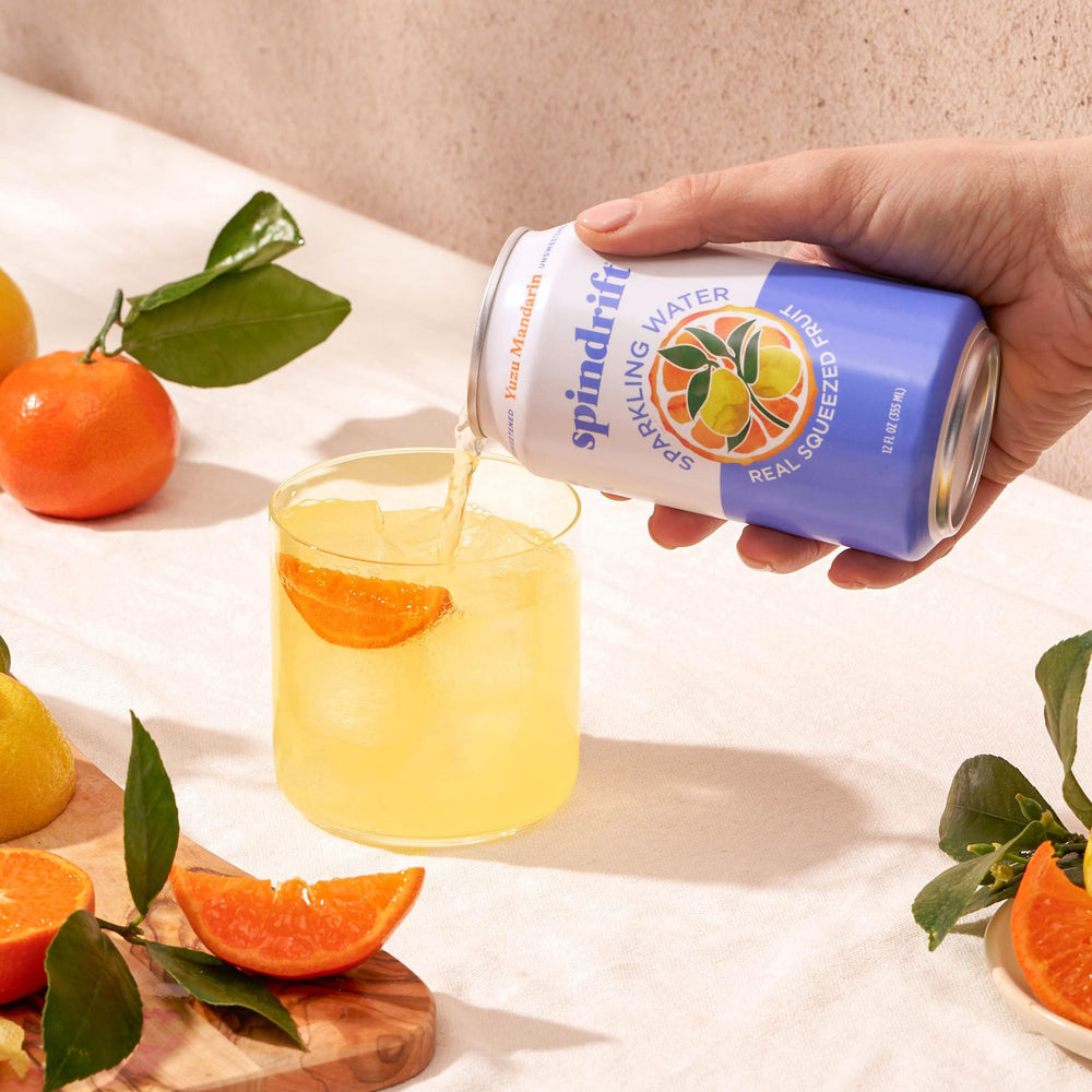 Display of 24-pack Spindrift Yuzu Mandarin cans for gatherings