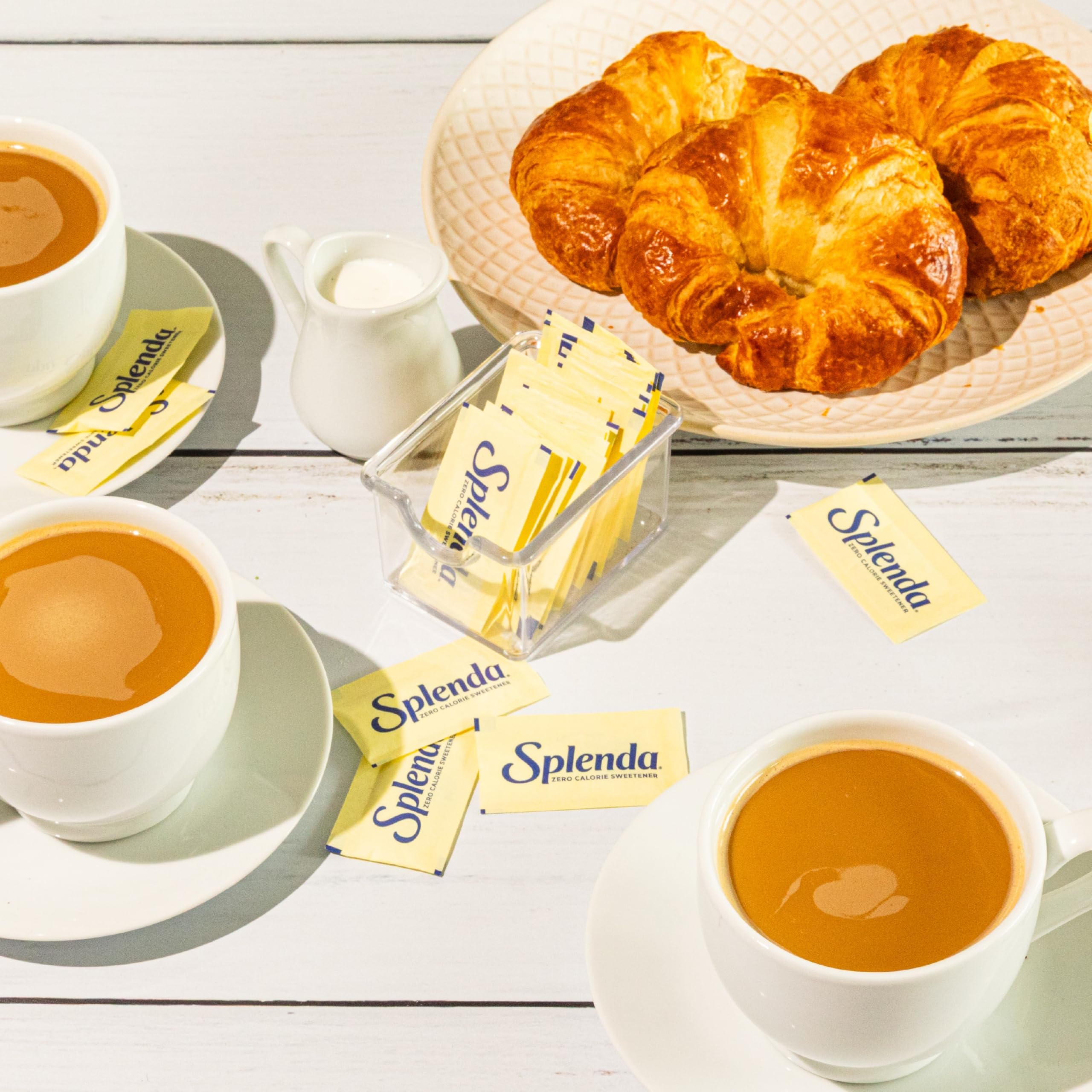 SPLENDA packets with measuring spoons for precise recipe sweetness.
