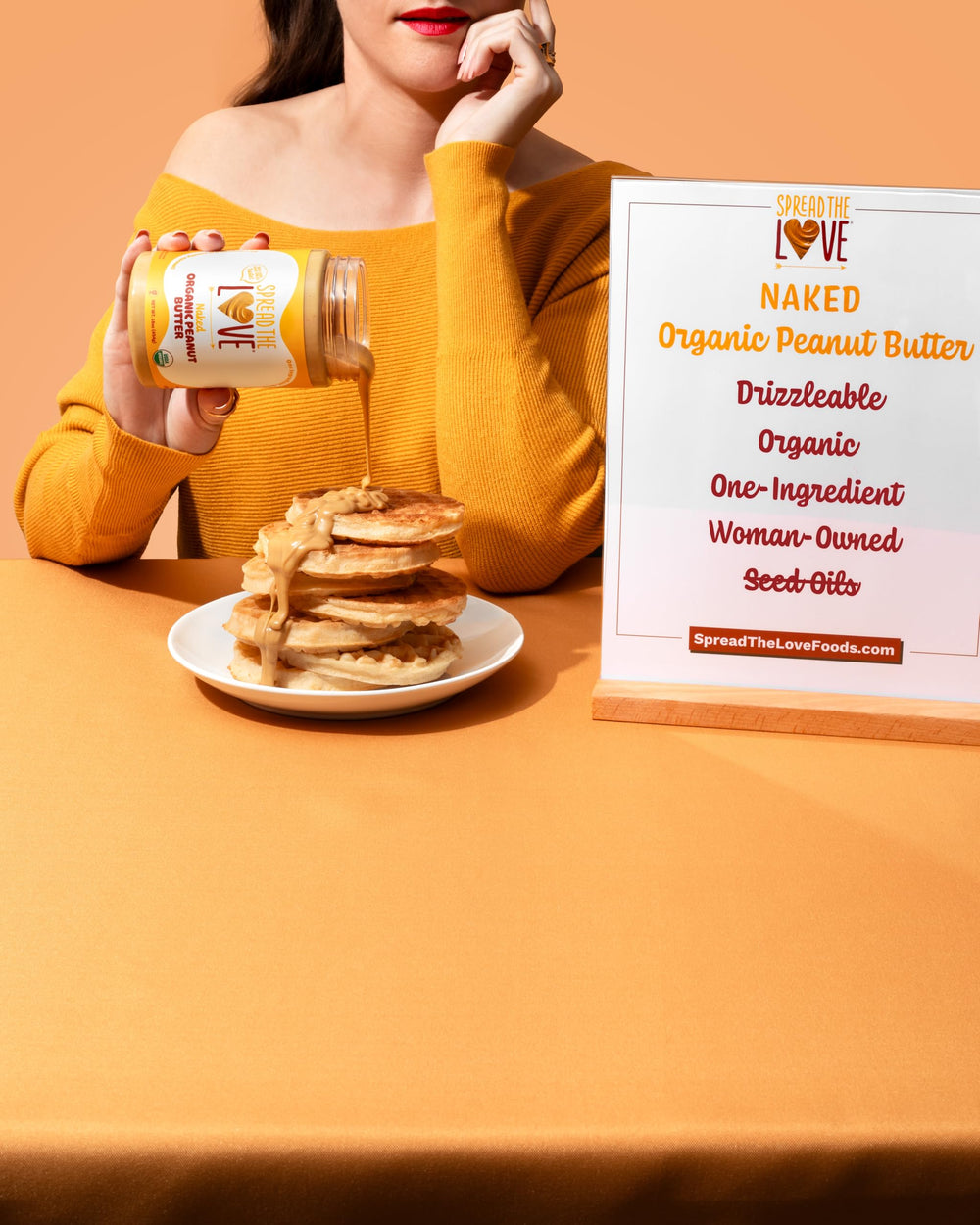 Spread The Love Naked Organic Peanut Butter spread, protein-rich snack option.