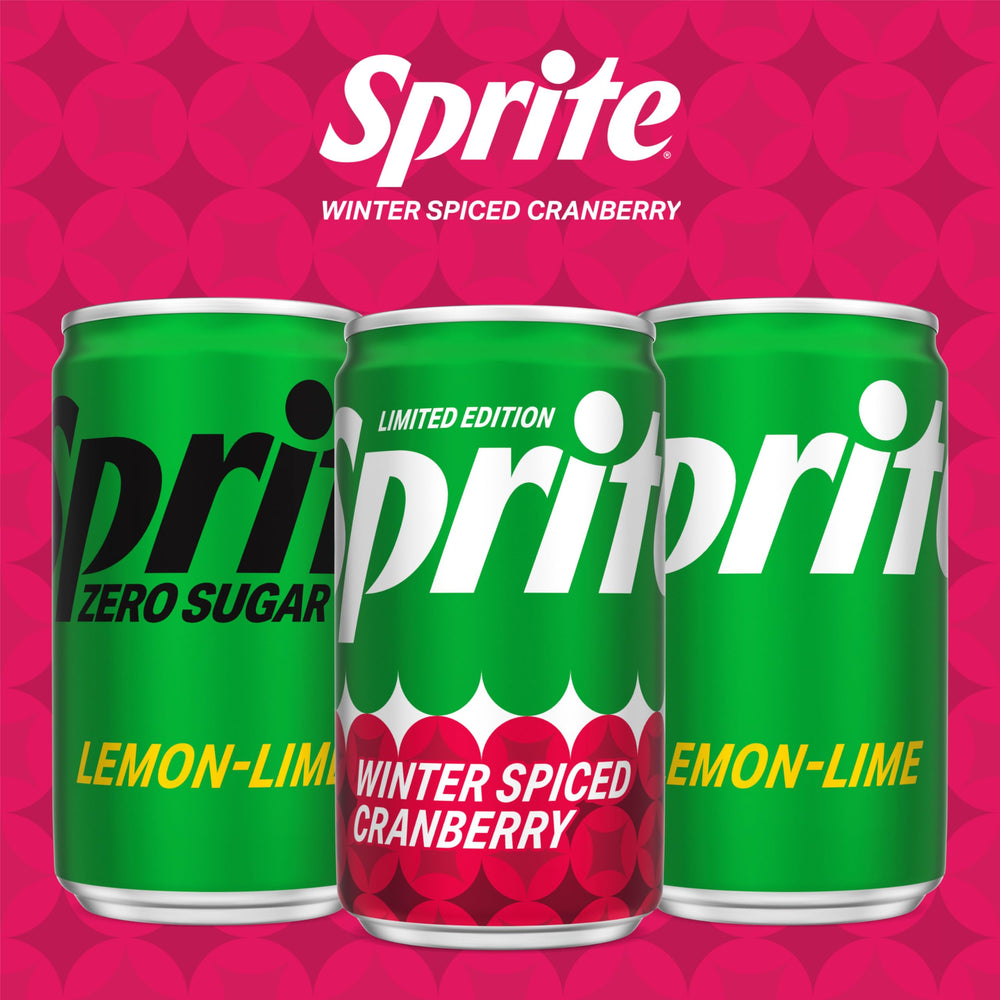 Holding Sprite Winter Spiced Cranberry mini can during a chilly night.