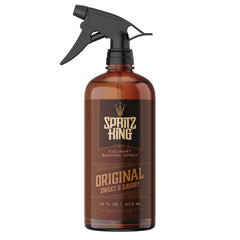 Spritz King bottle misting over barbecue for even coverage and flavor
