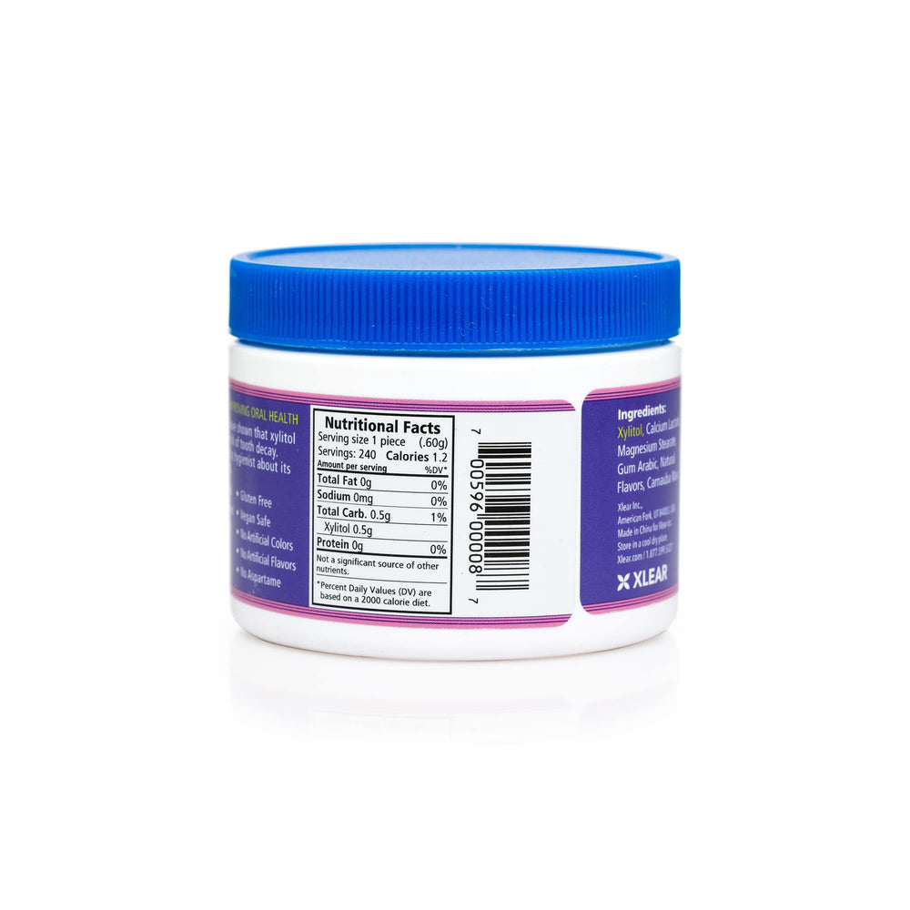 Spry Berry Blast Mints on office desk for quick breath refresh.