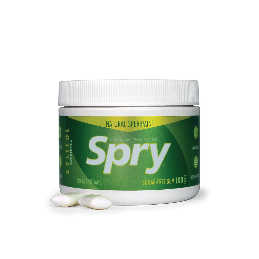 Spry Travel-ready gum jar on desk suggests convenient, mess-free refreshment.