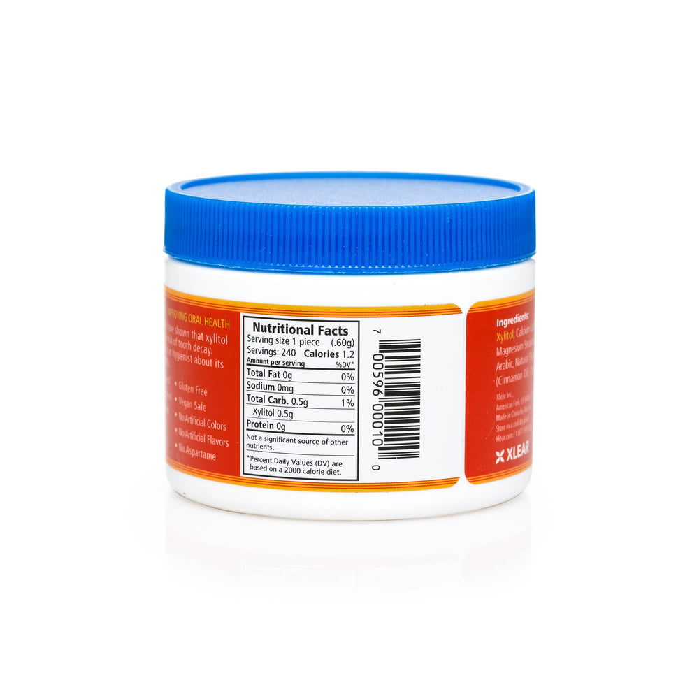 Spry Xylitol Cinnamon Mints close-up emphasizes natural cinnamon flavor.