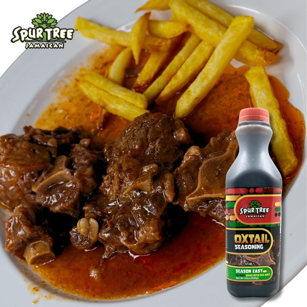 Warm kitchen scene with Spur Tree Oxtail Seasoning jar on counter.