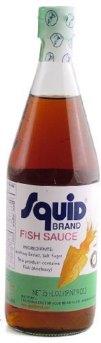Squid Thai Fish Sauce bottle pouring, enhances umami in soups and stir-fries.