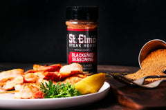 St. Elmo Blackened Seasoning pour shows rich paprika and garlic aroma enhancing dishes.