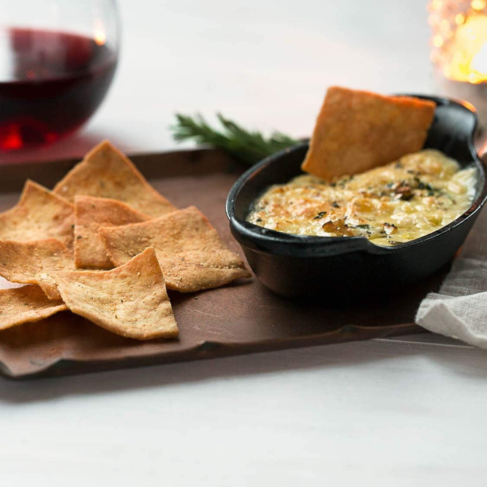 Stacy's Tomato & Basil pita chips with cheese board, ideal party snack.