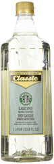 Starbucks Classic Syrup bottle on kitchen counter for at-home drinks.