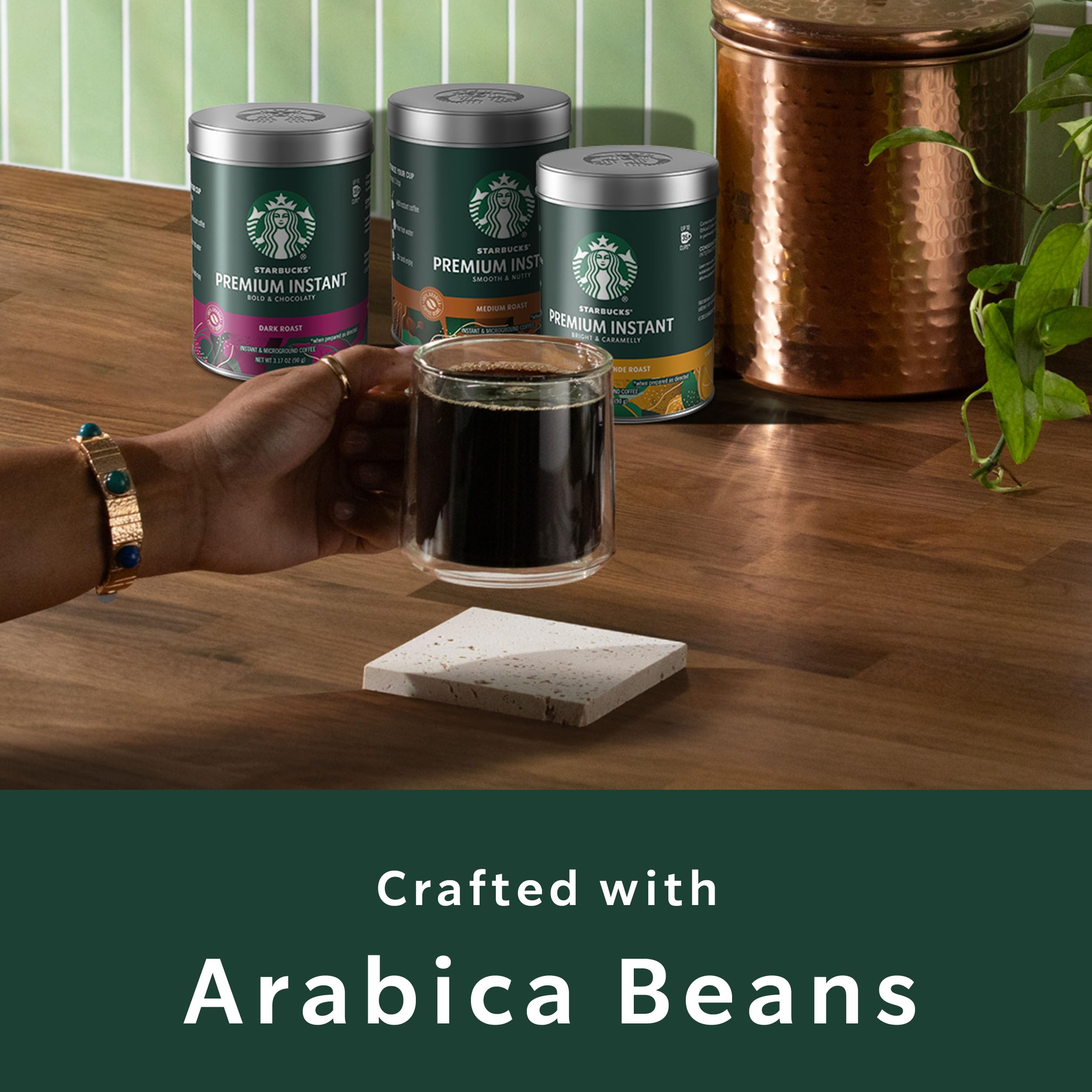 Starbucks premium instant coffee scoops beside tin for effortless servings.