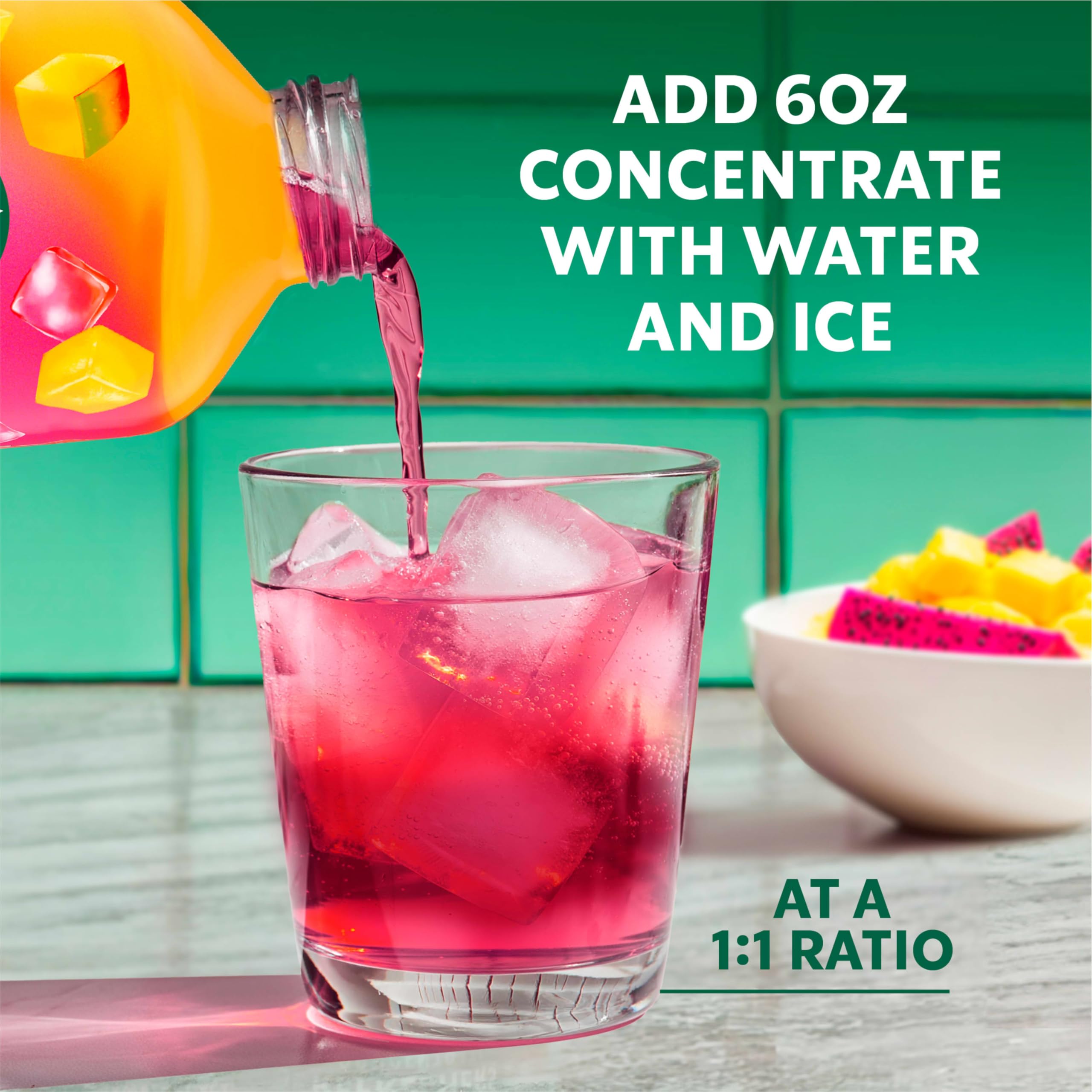 Glass with the bright drink and straw showcasing tropical hues