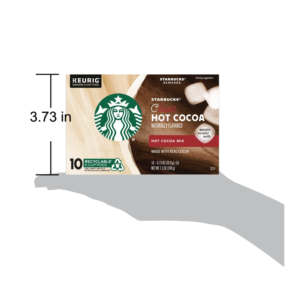 Pouring Starbucks hot cocoa into a mug after brewing, smooth and inviting.