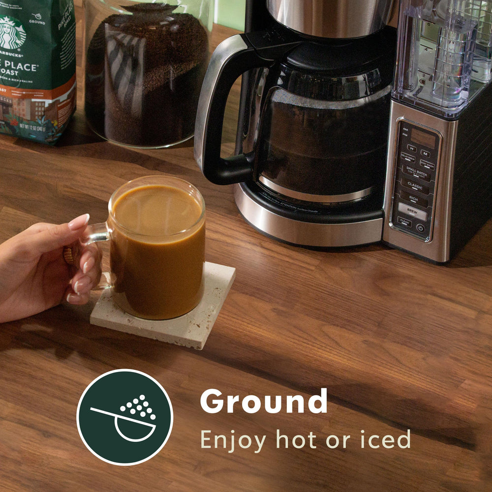 Starbucks Sumatra coffee beans close-up reveals glossy roast and earthy notes for aroma