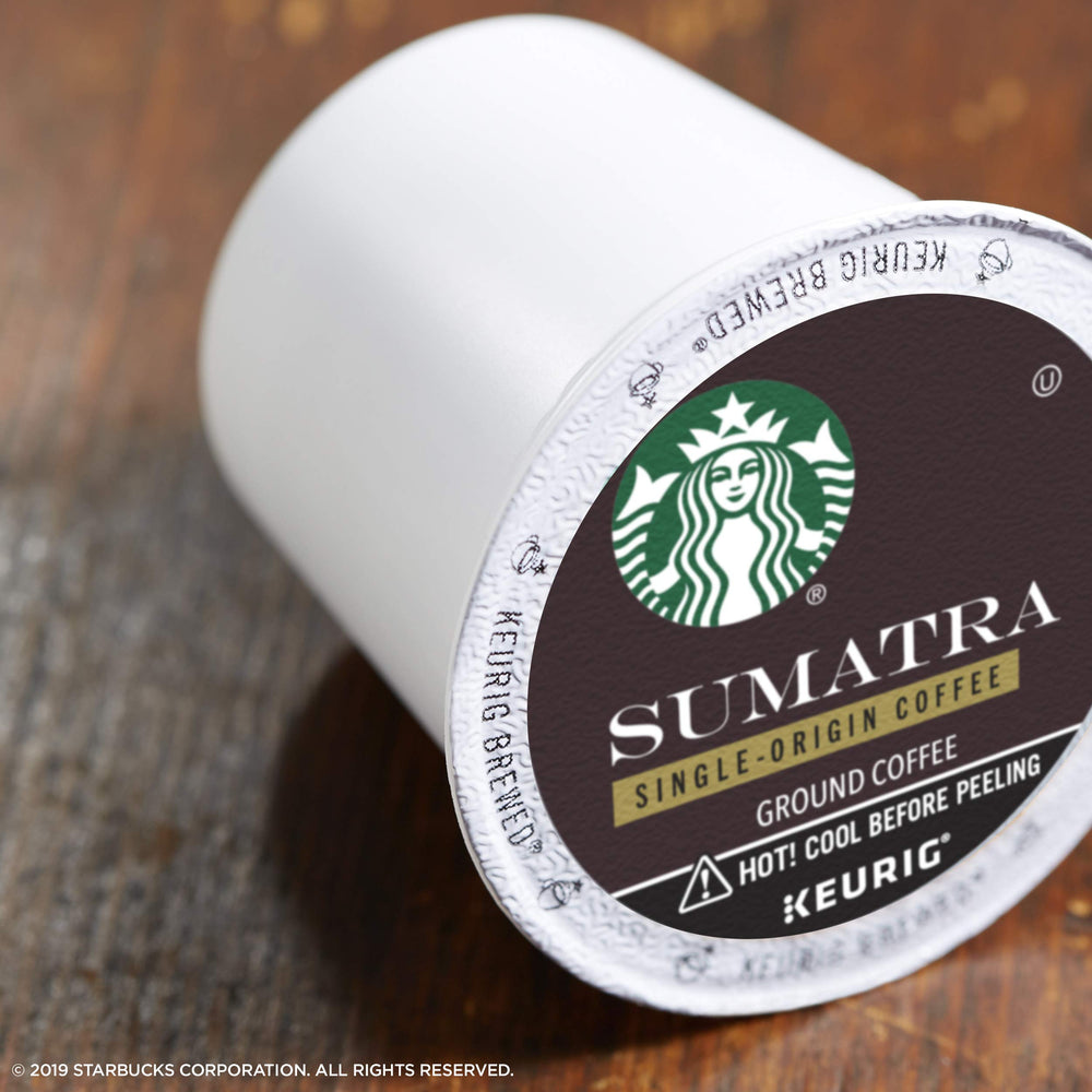 Steam rising from a Sumatra Dark Roast cup highlighting rich, earthy aroma.