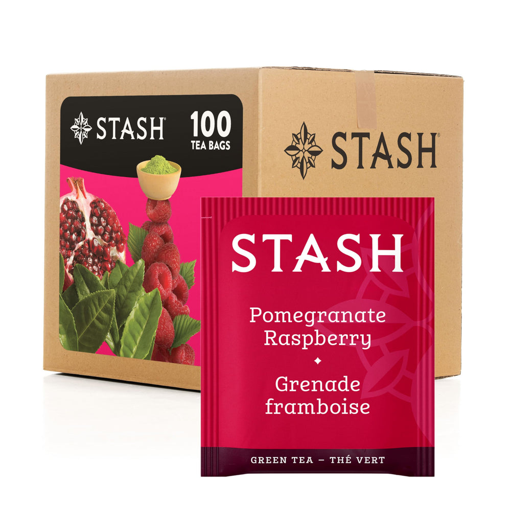 Stash Tea Pomegranate Raspberry Green Tea bags ready for steeping in a cup.