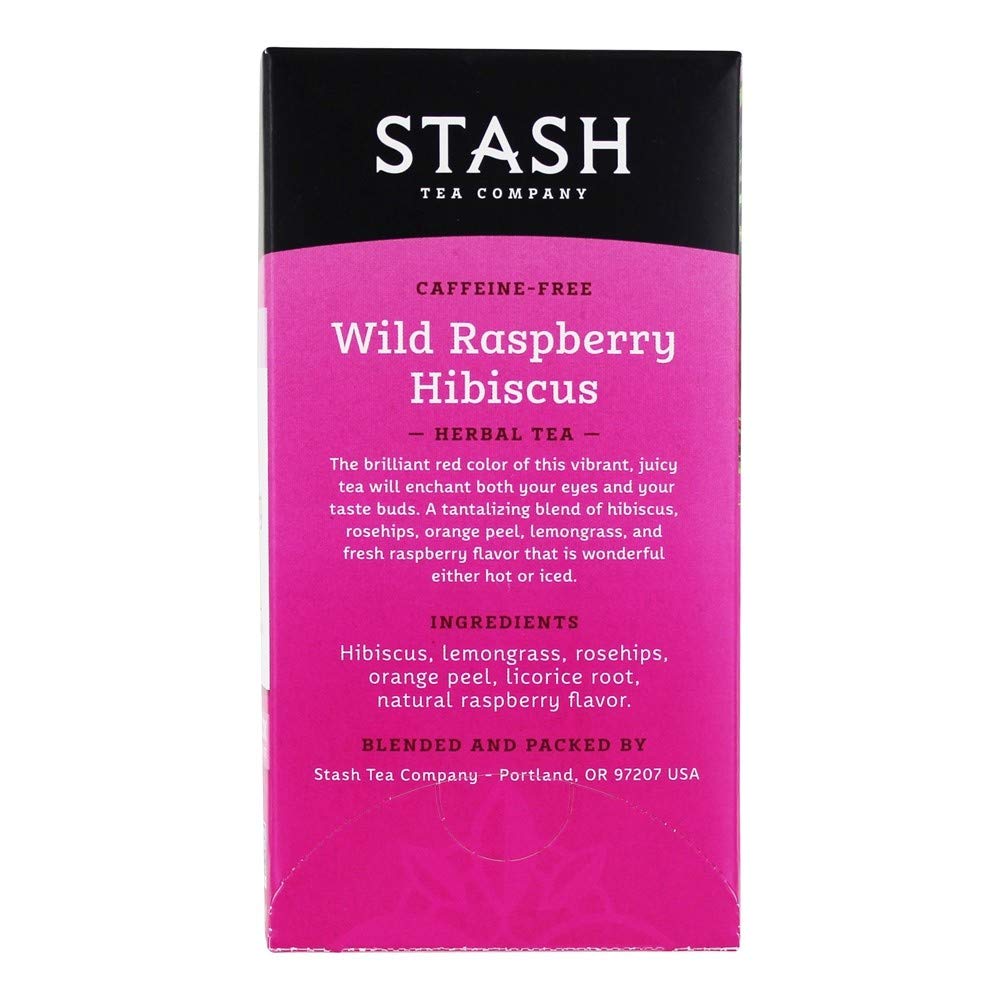 Stash Tea Wild Raspberry Hibiscus infusion in a glass with a vibrant hue.