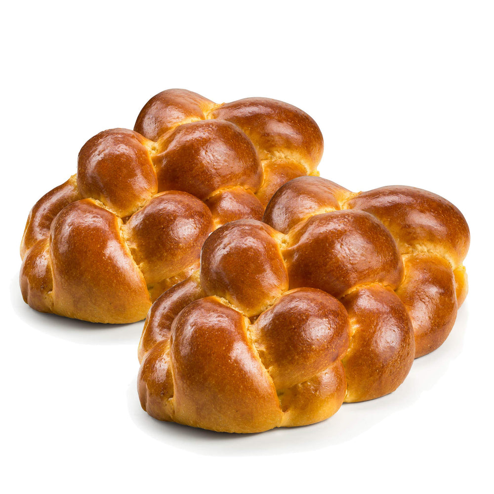 Stern's Bakery challah braid on a cutting board, fresh and soft for Shabbat dinners.