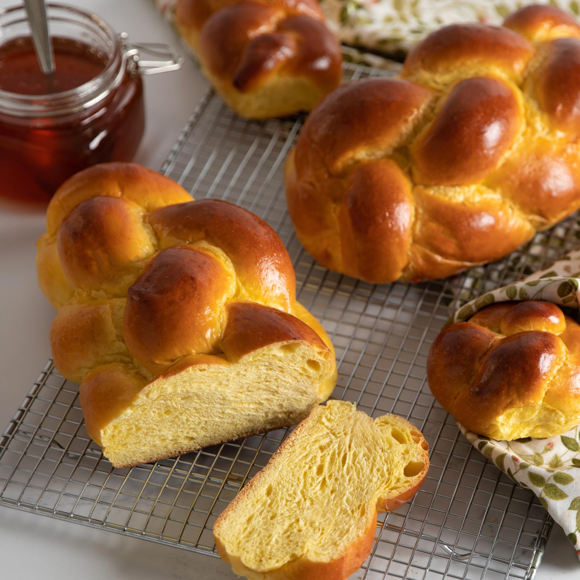 Stern's Bakery challah oven-fresh, aromatic crust ready to slice for holidays.