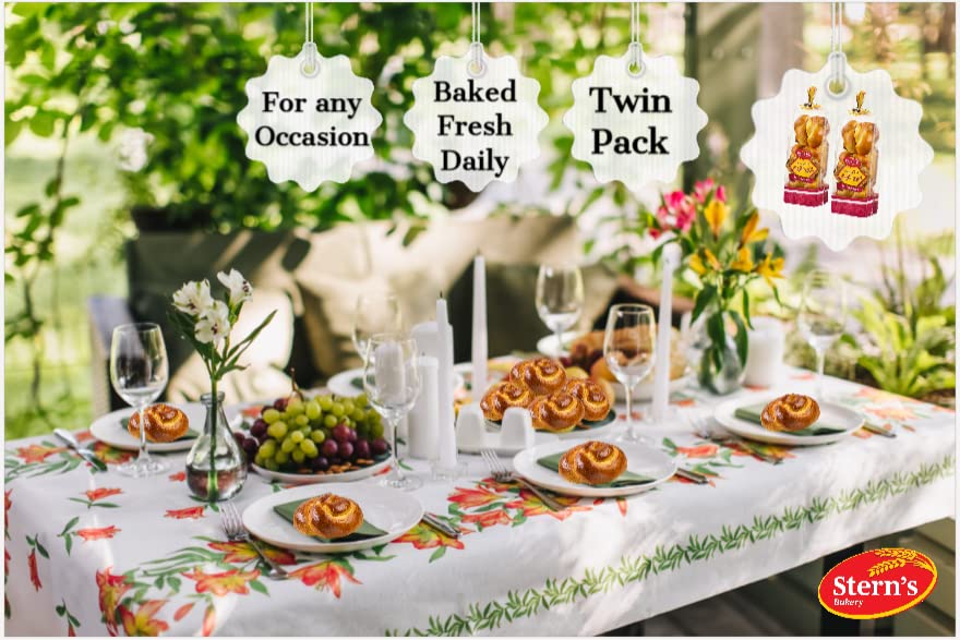 Stern's Bakery challah rolls on a Shabbat table setting evoke tradition.
