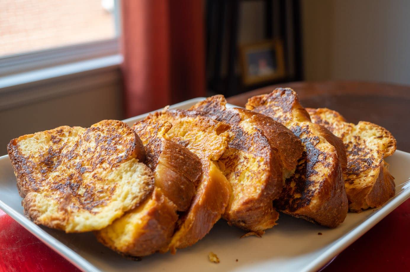Stern's Bakery challah on Shabbat table, inviting festive warmth.