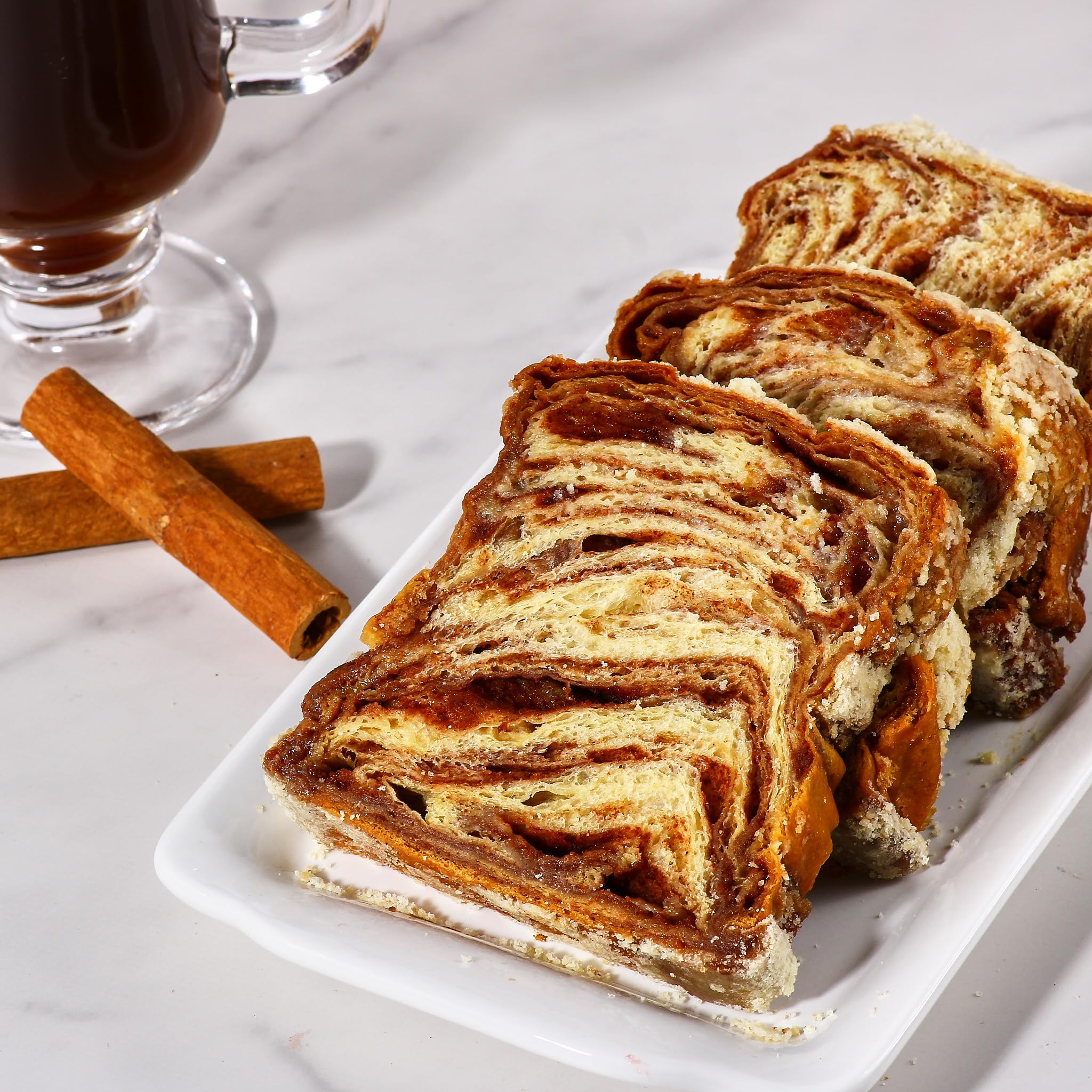 Stern's Bakery Cinnamon Babka served with coffee, ideal for mornings
