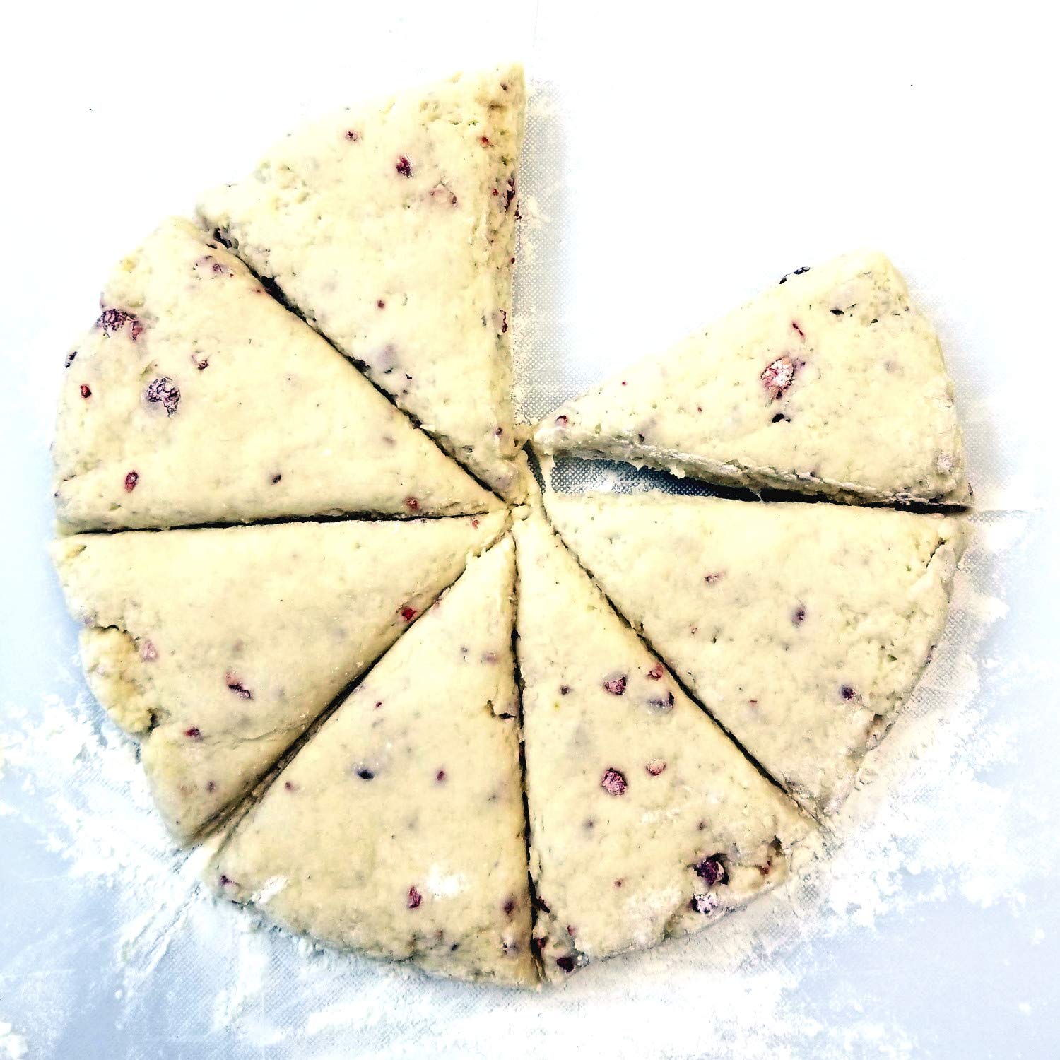 Sticky Fingers scone mix original finished scones served with clotted cream and fruit preserves.