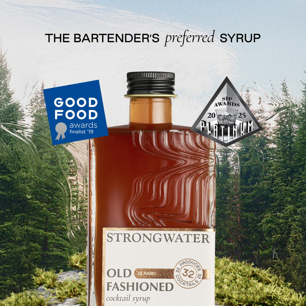 Strongwater bottle and glass setup ready to serve an Old Fashioned