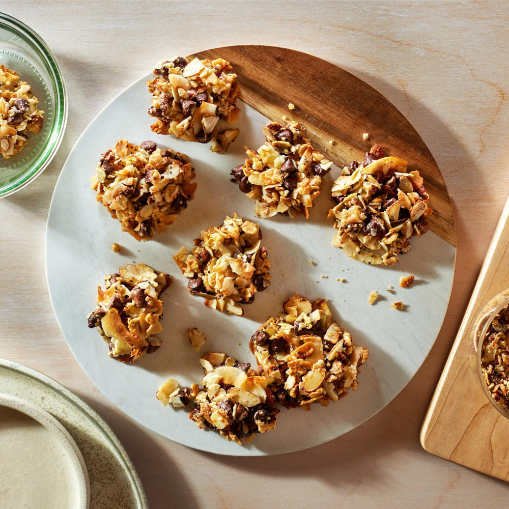 Struesli Original Granola kitchen scene with spoon and oats-free label.